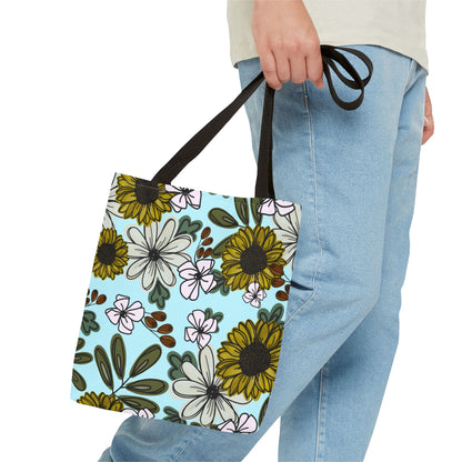 Reusable canvas tote bag with a cheerful sunflower and floral pattern, ideal for carrying books, groceries, or personal items in style