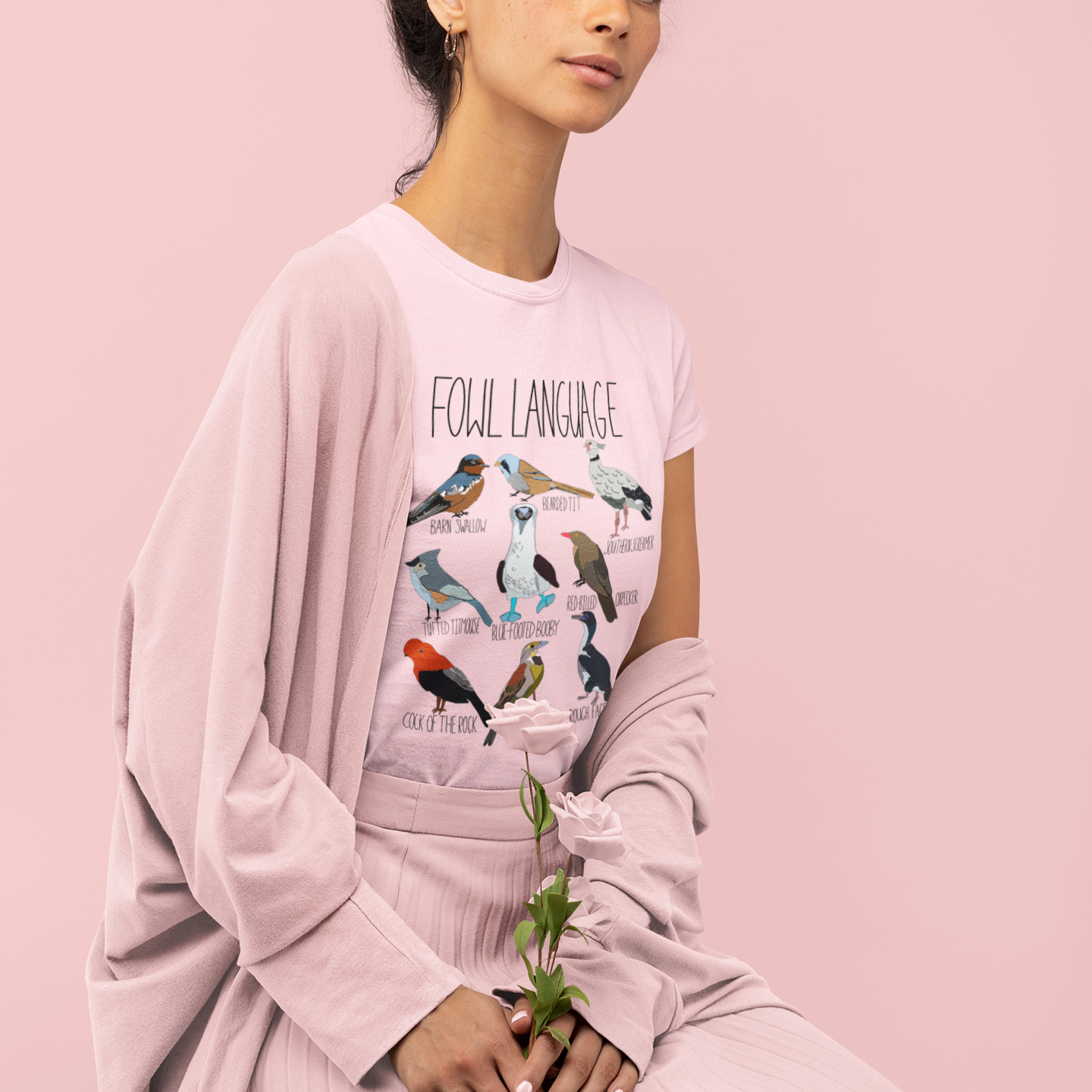 Model wearing the 'Fowl Language' t-shirt in a casual setting, styled with jeans for a fun and relaxed look. Ideal for bird watchers and pun enthusiasts.