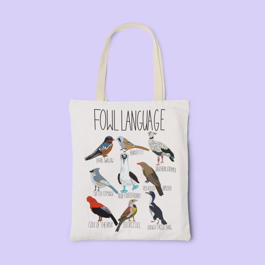 canvas tote bag featuring the playful 'Fowl Language' design with illustrations of birds like the blue-footed booby and dickcissel. Displayed on a light background, perfect for bird lovers and pun enthusiasts