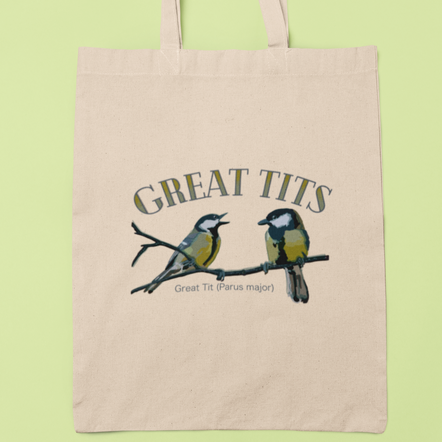 Eco-friendly canvas tote bag with illustrated great tits and fun typography, displayed on a light green background. Ideal for bird watchers and quirky gift ideas.