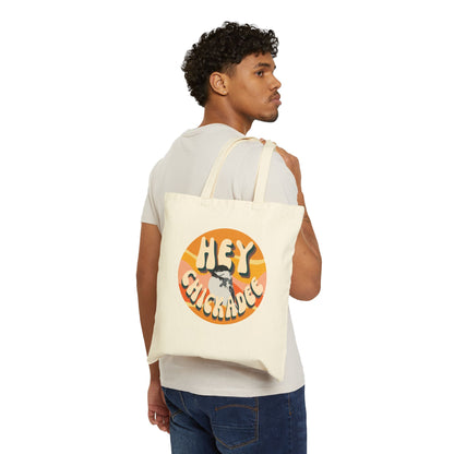 Canvas tote bag featuring the playful 'Hey Chickadee' design, carried by a model, ideal for casual use or as a fun gift for bird enthusiasts