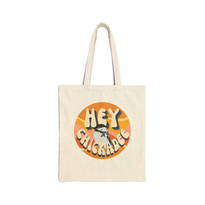 Natural canvas tote bag with the 'Hey Chickadee' design in bold retro typography and vibrant artwork, displayed flat on a white background for a clean and detailed look.