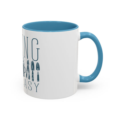 White ceramic mug showing the front view with 'Hoeing Ain't Easy' text and garden tool illustrations, displayed on a white background.