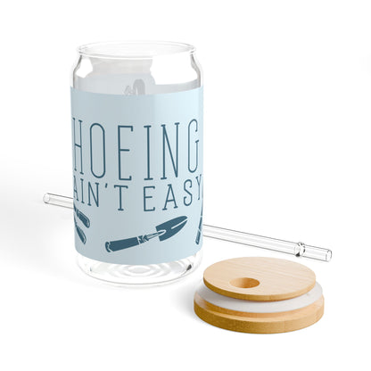 Bamboo lid and clear reusable straw of the 'Hoeing Ain't Easy' glass tumbler, showcasing its sustainable and practical design.