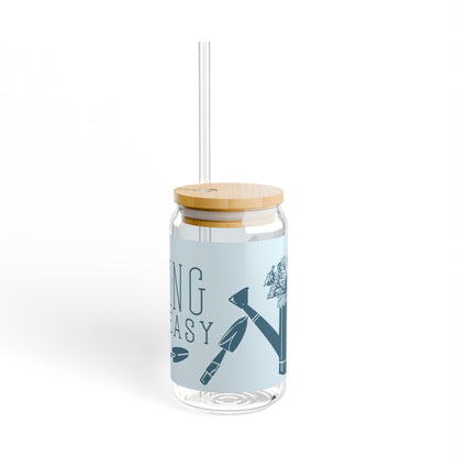 Final side view of the 'Hoeing Ain't Easy' reusable glass tumbler, showcasing the full wrap-around design with garden-themed illustrations, displayed on a white background