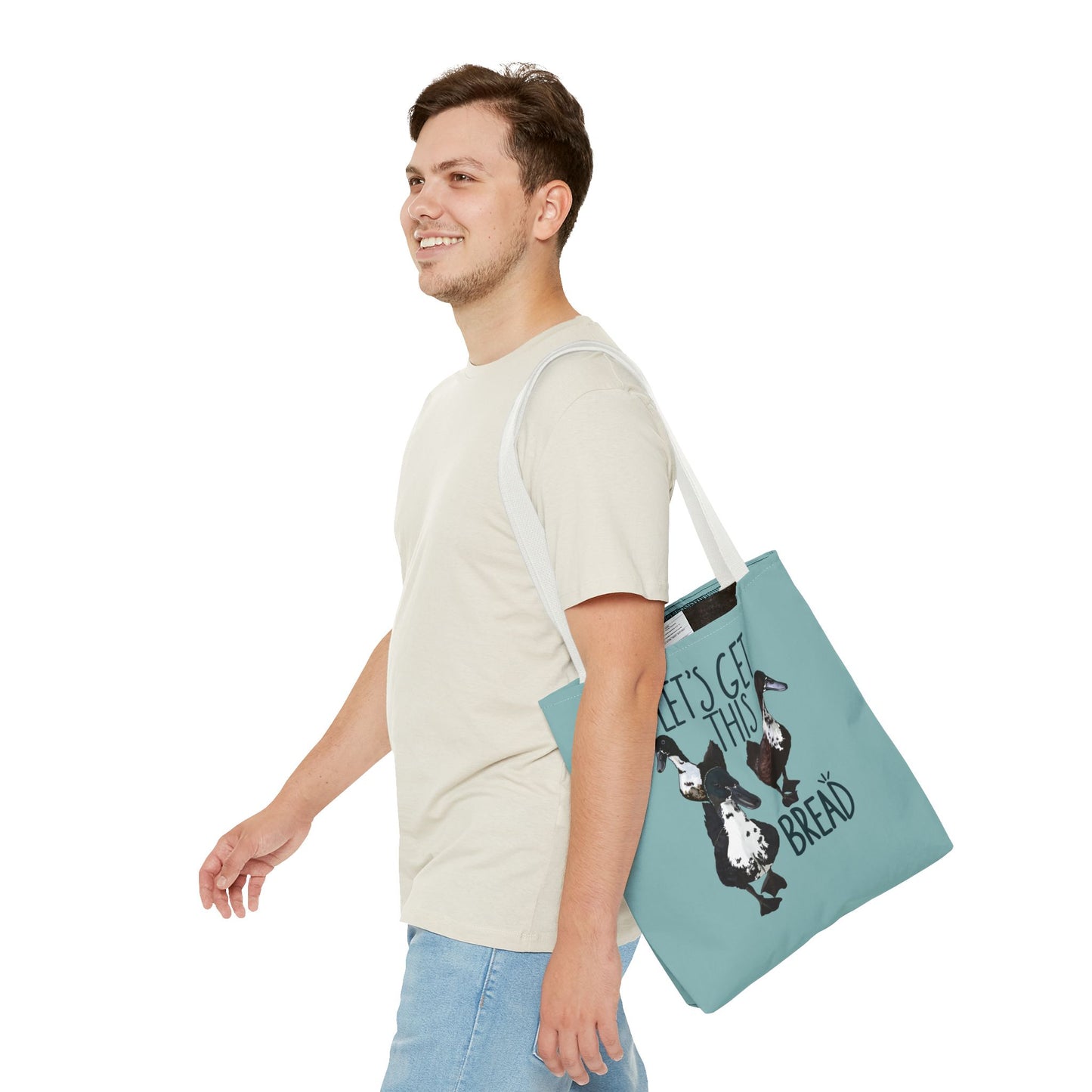 Canvas tote bag with the fun 'Let’s Get This Bread' design, displayed in use, making it an ideal everyday accessory for style and practicality.