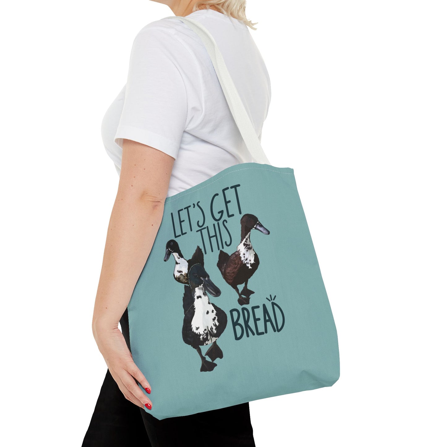 Canvas tote bag with the fun 'Let’s Get This Bread' design, displayed in use, making it an ideal everyday accessory for style and practicality.