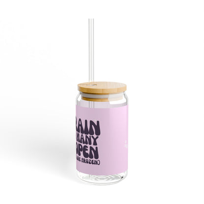 16oz reusable glass tumbler with bamboo lid and straw featuring the humorous quote 'My Brain Has Too Many Tabs Open (And at Least 9 Are Frozen)' in bold, playful typography on a pastel pink background. Perfect for multitaskers with a sense of humor.