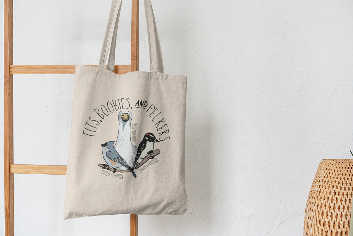 Close-up view of the 'Tits, Boobies, and Peckers' tote bag, highlighting the humorous bird illustrations 