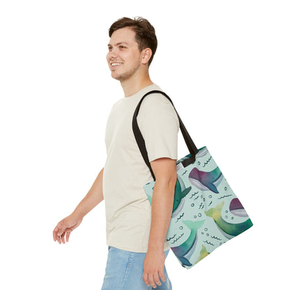 Canvas tote bag with a watercolor whale pattern, carried by a model for a stylish and eco-friendly everyday accessory.