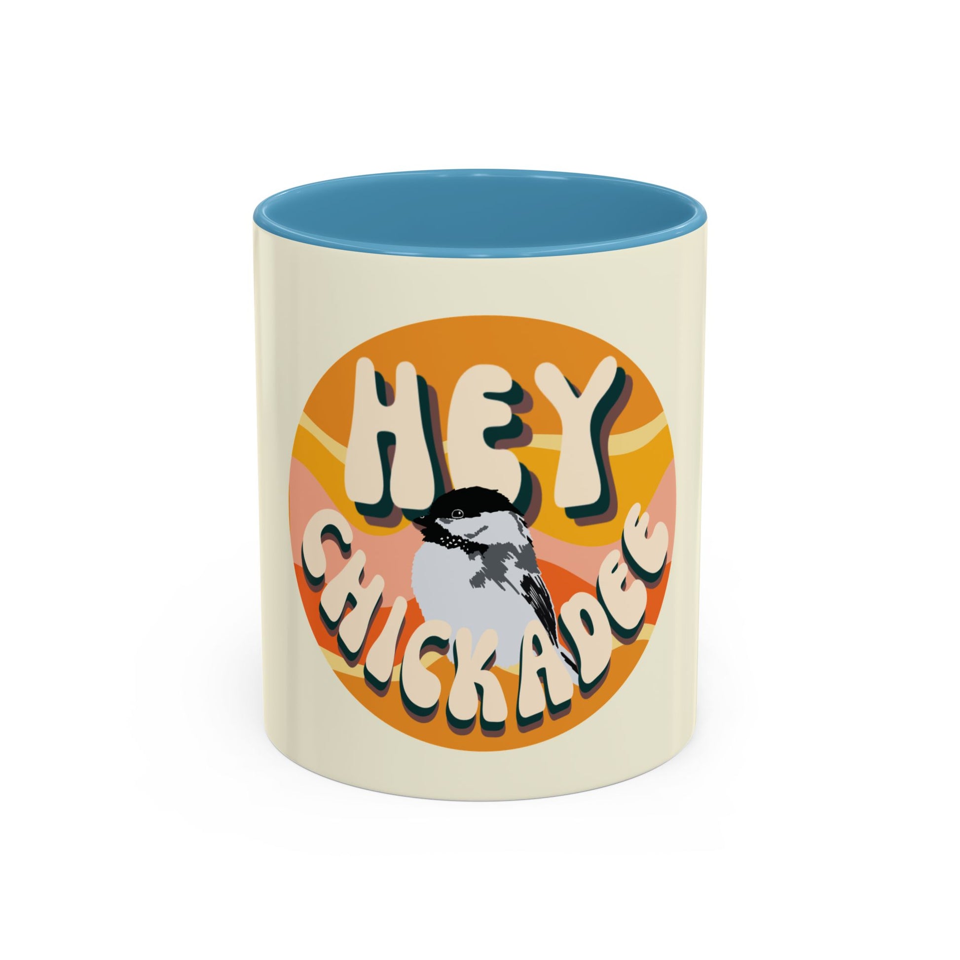 White ceramic mug with a whimsical illustration of a chickadee perched on a branch, accompanied by the playful text 'Hey Chickadee!' in bold lettering. Perfect for bird lovers and coffee enthusiasts.