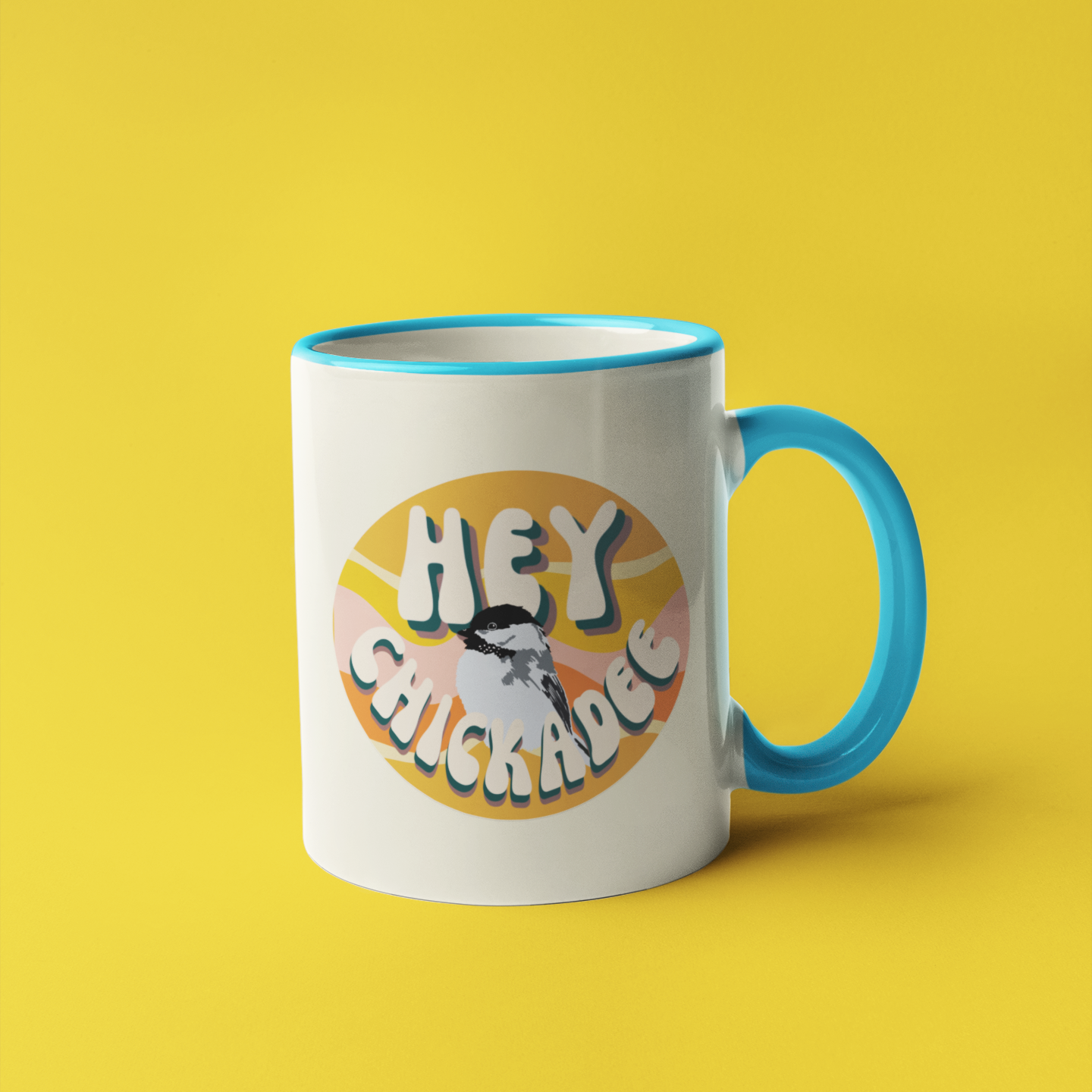 White ceramic mug with a whimsical illustration of a chickadee perched on a branch, accompanied by the playful text 'Hey Chickadee!' in bold lettering. Perfect for bird lovers and coffee enthusiasts.