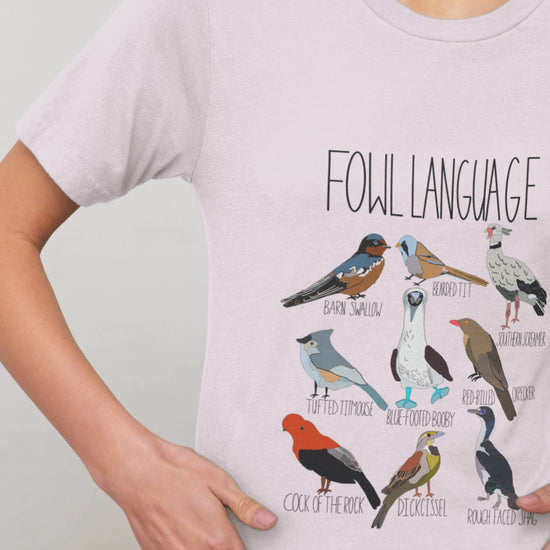 Close-up of the 'Fowl Language' t-shirt design, highlighting the bold text and vibrant bird illustrations on soft cotton fabric